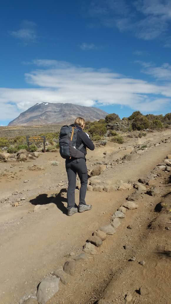 A climber walking the trail towards Kibo