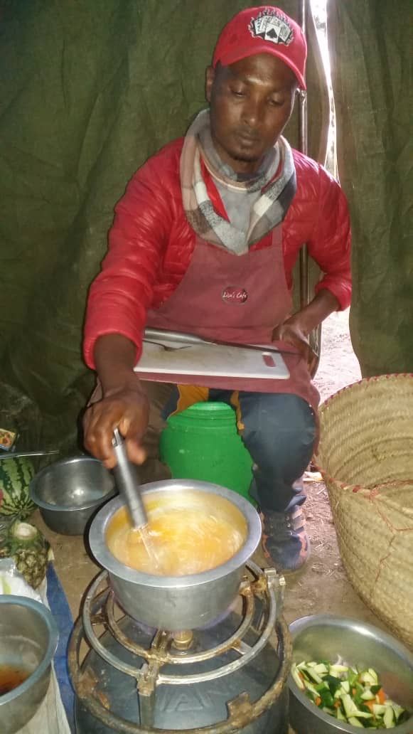 Manuel, our cook, preparing soup in the kitchen tent