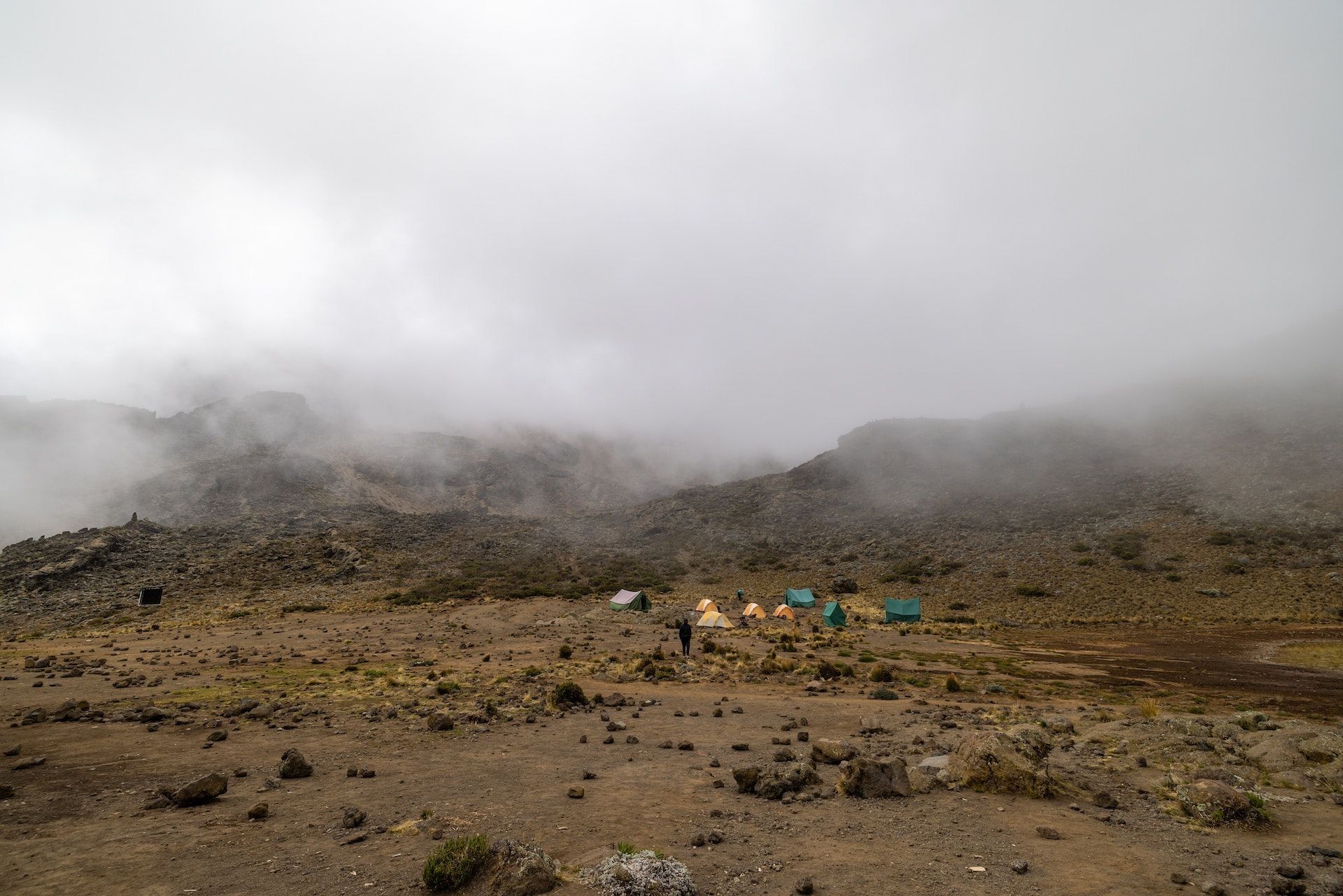 Tents at a misty camp in the alpine desert