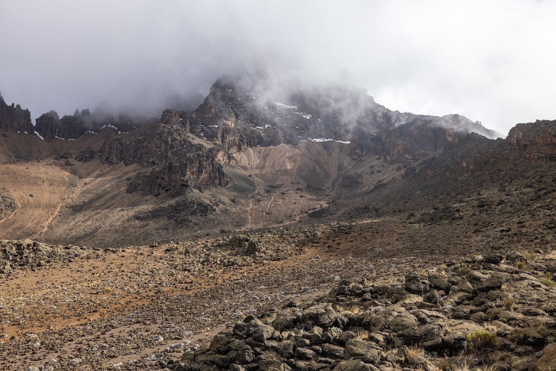 Rocky ridges of Kilimanjaro disappearing into the clouds