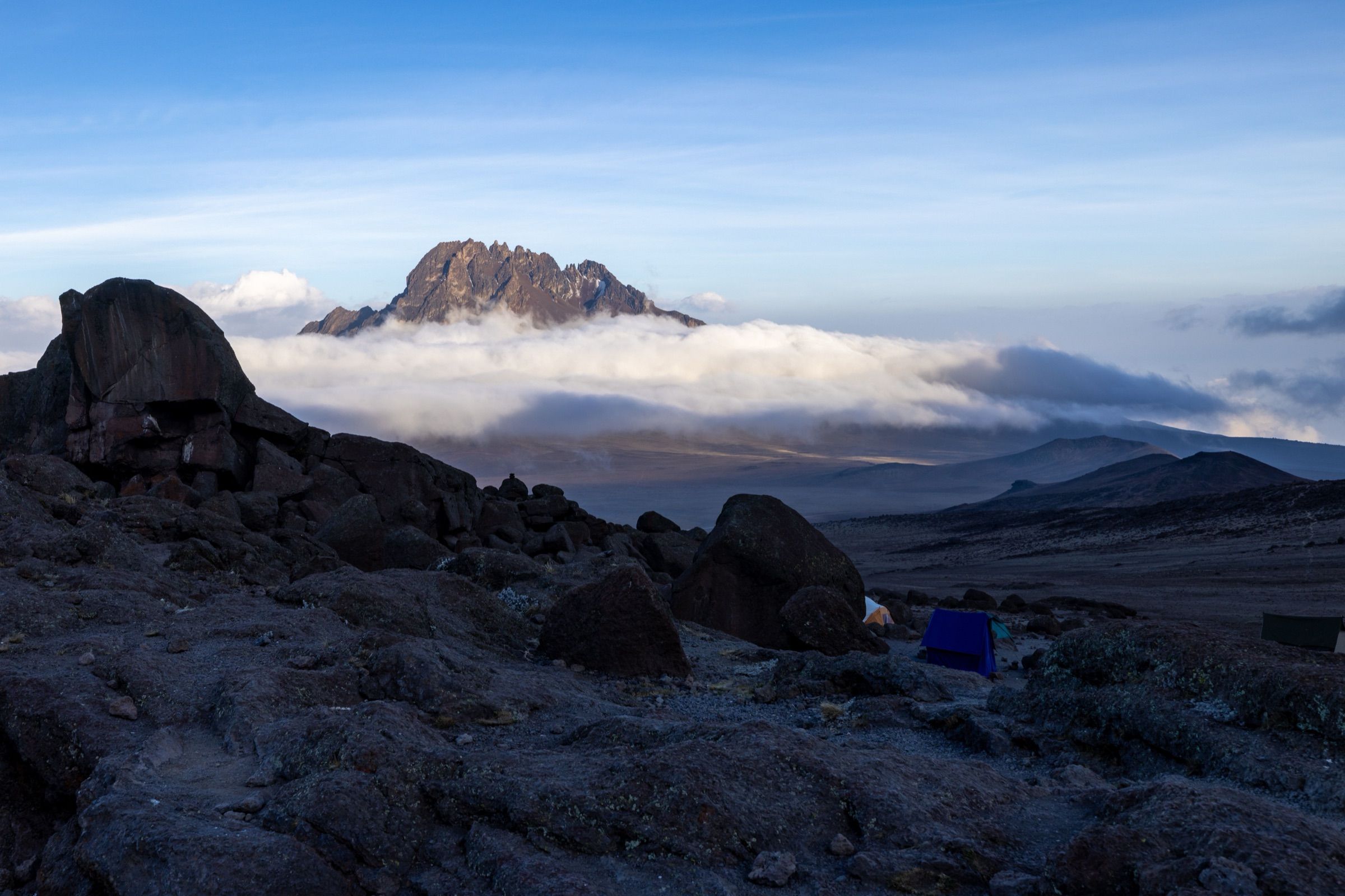 Mawenzi peak above a sea of clouds at dusk, seen from a high camp